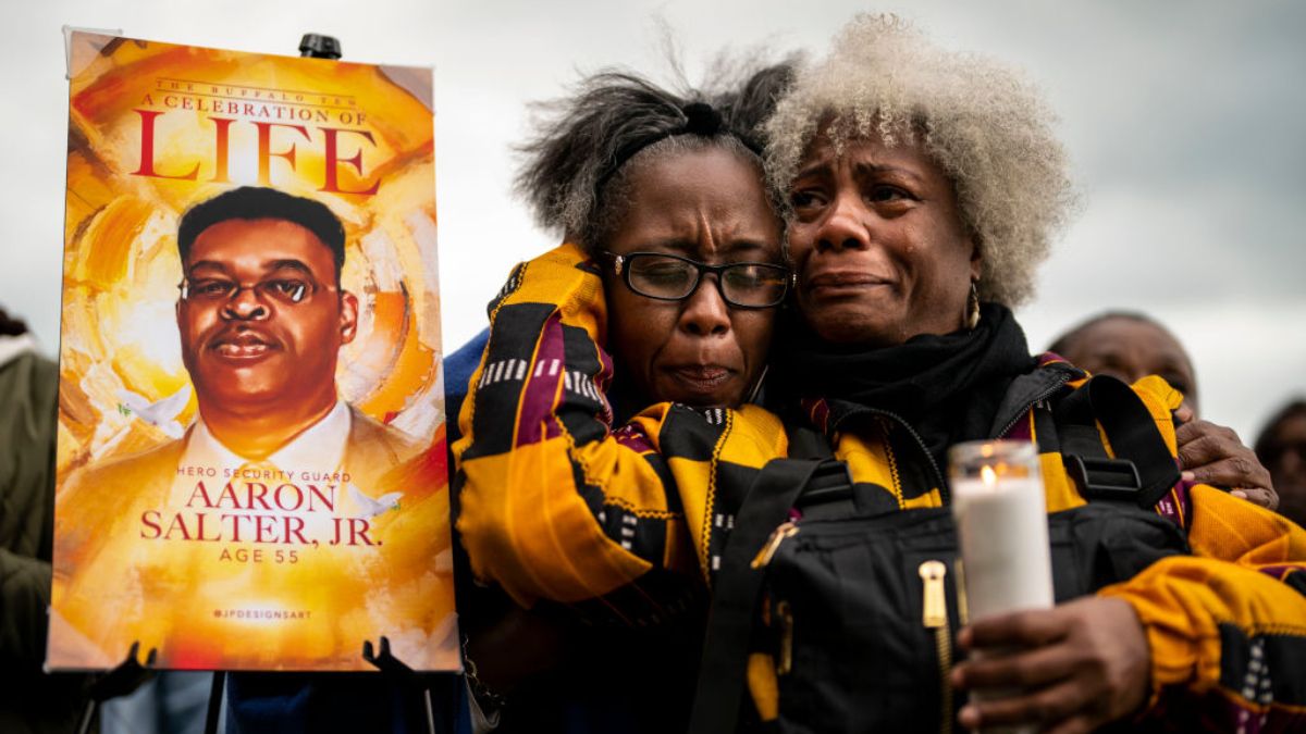 Janate Ingram, and Cariol Horne, both of Buffalo, attend a vigil across the street from Tops Friendly Market at Jefferson Avenue and Riley Street on Tuesday, May 17, 2022 in Buffalo, NY. 