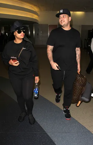 Matchy Match - Rob Kardashian and fiancée Blac Chyna were spotted making their way through arrivals at LAX in matching black 'fits.(Photo: PacificCoastNews)