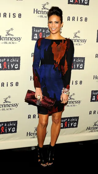 Make a Statement - Paula proves fashion is fun in this patterned long-sleeve dress.(Photo: Stephen Lovekin/Getty Images)