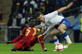 Soccer Match - England’s Jack Wilshere (right) grapples with Ghana’s Anthony Annan during their international soccer friendly match at London’s Wembley Stadium Tuesday. The game ended in a 1-1 tie. (Photo: AP Photo/ Tom Hevezi)