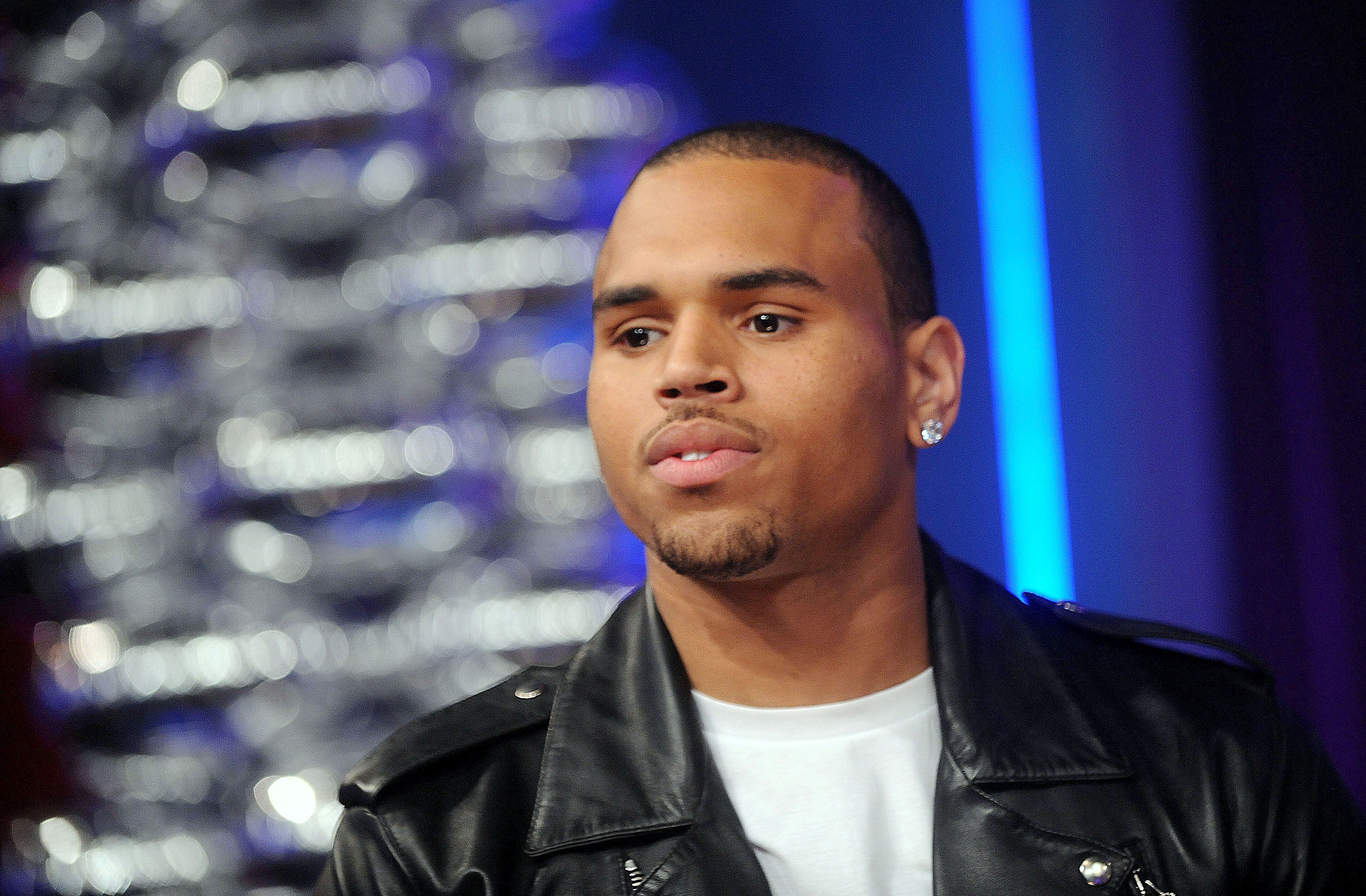 Chris Brown lashing out at photographers\r&nbsp; - "Y'all n---as is weak. Did you call them to try and film me? Y'all n---as is gay!"\r&nbsp;(Photo: Brad Barket/PictureGroup)