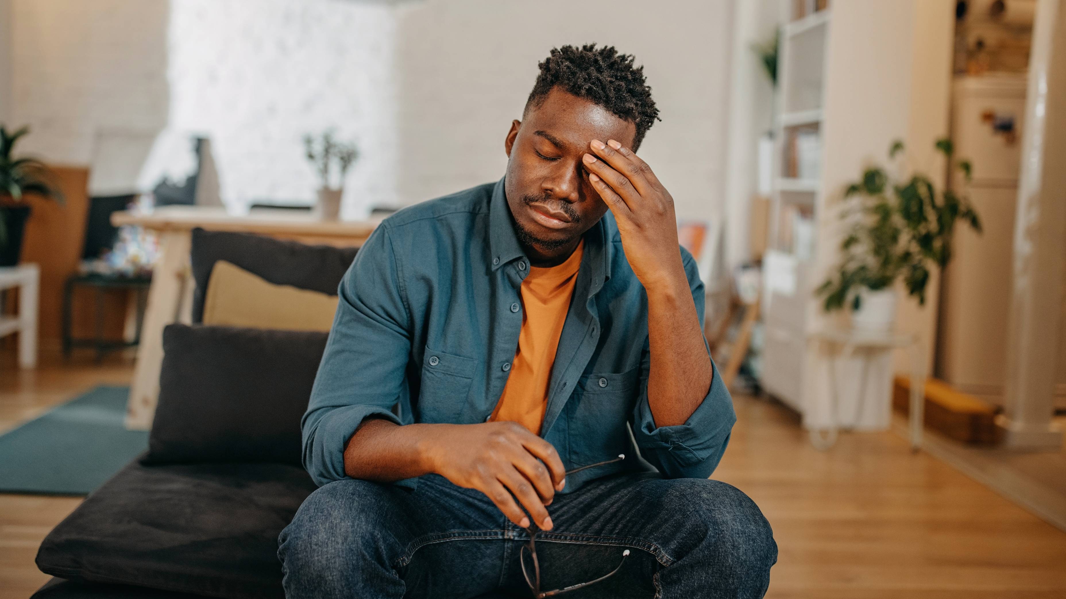 Young Black man having pain.