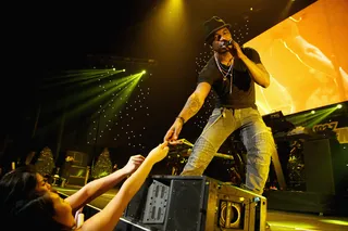 Shine a Light - Ne-Yo reaches out to touch adoring fans while performing onstage during KIIS FM's 2012 Jingle Ball at Nokia Theatre L.A. Live in Los Angeles.(Photo: Christopher Polk/Getty Images for Clear Channel)