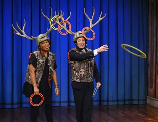 Good Fun - Queen Latifah and Jimmy Fallon play a game of Antler Ring Toss during a taping of Late Night With Jimmy Fallon at Rockefeller Center in New York City. (Photo: Theo Wargo/Getty Images)