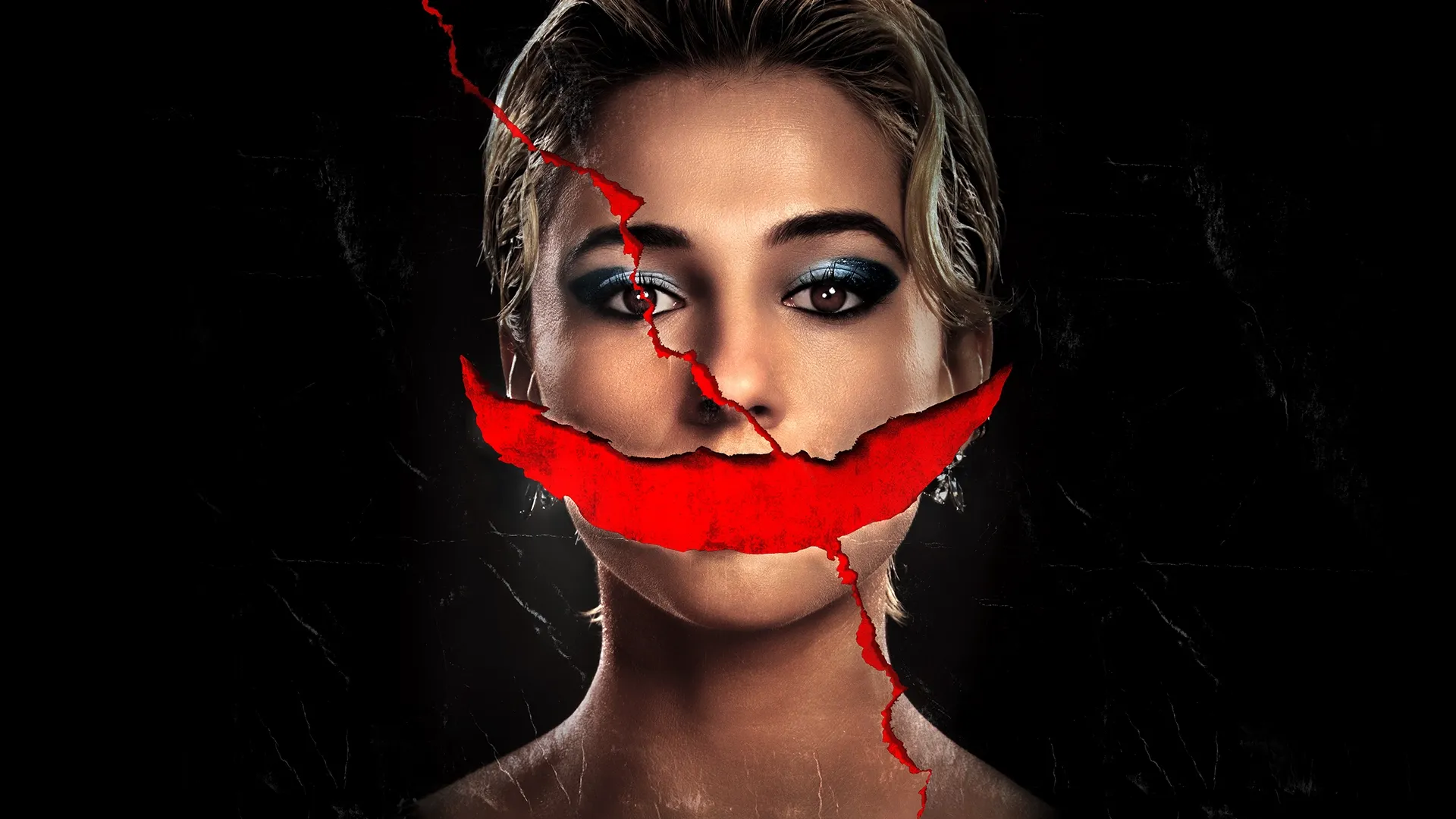 Naomi Scott against a black background with her mouth torn from the image.