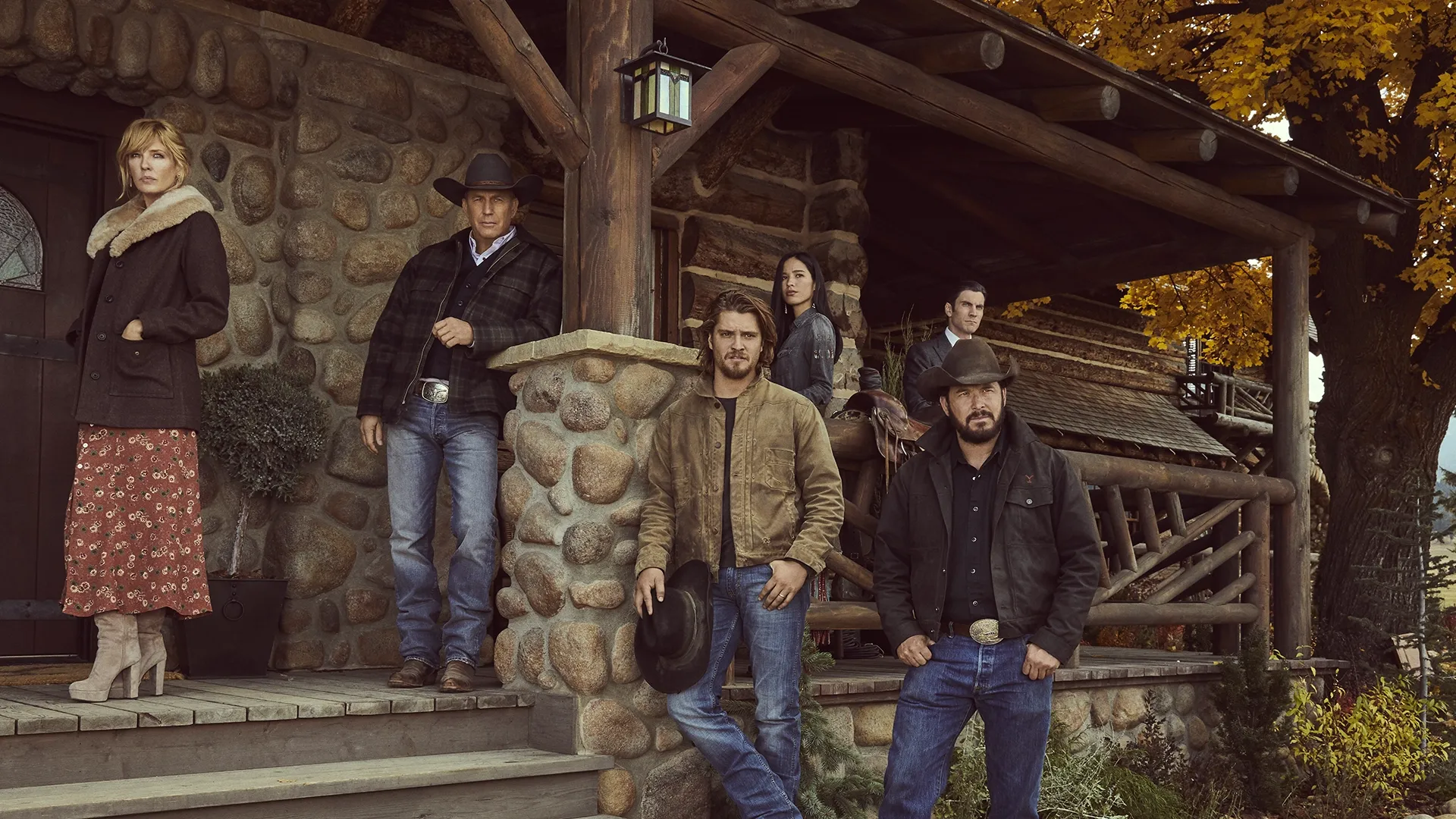 Yellowstone cast on a cabin porch.