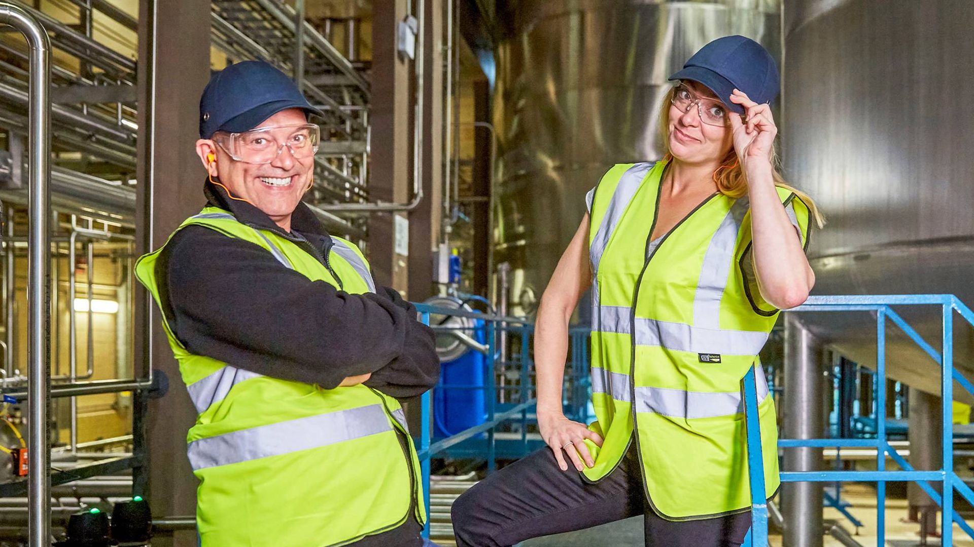 Gregg Wallace and Cherry Healey wearing safety gear in a factory.